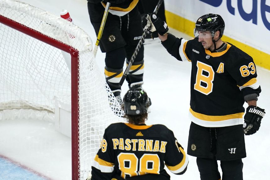 Marchand has 2 goals and an assist in return, Bruins roll