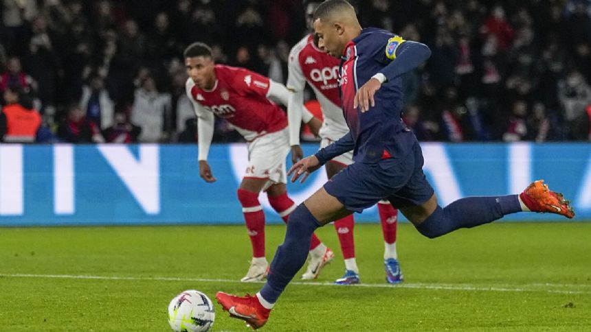 Mbappe scores a penalty as PSG beats Monaco 5-2 to move four points clear at the top