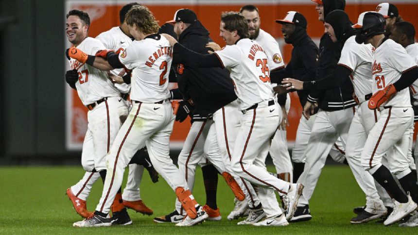 McCann has 2-out, 2-run single in 9th, Orioles emerge from 5-hour rain delay to beat Royals 4-3