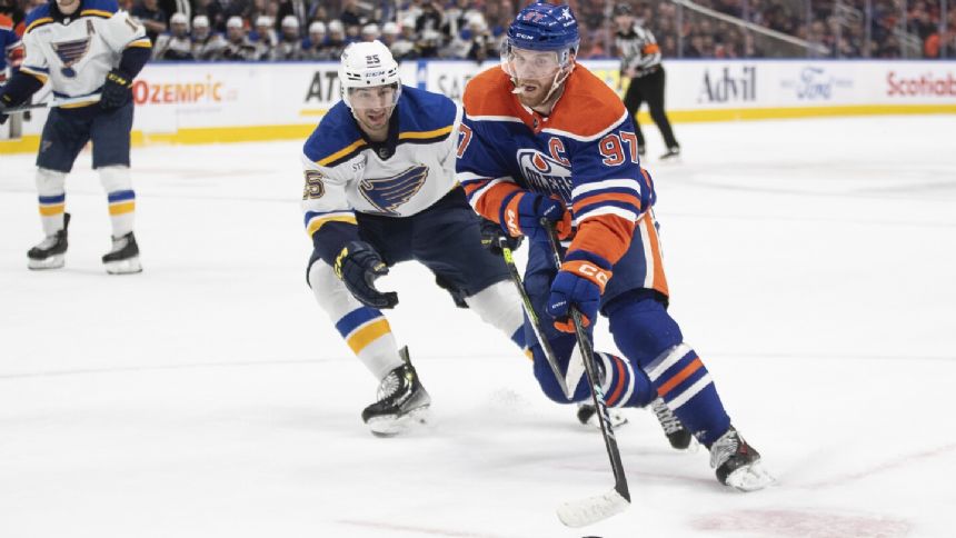 McDavid scores in OT to end 10-game drought as Oilers rally to beat Blues 3-2