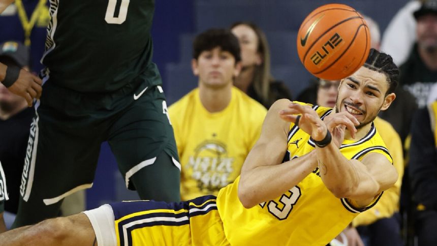 Michigan State continues its Big Ten push beating Michigan 73-63 behind Walker, Hall