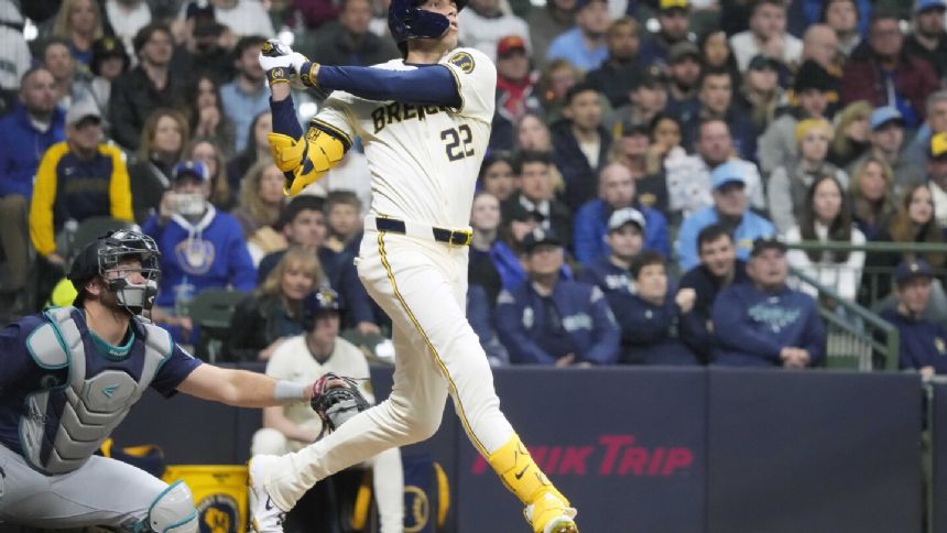 Milwaukee's Christian Yelich leaves the game in the second inning at Baltimore with back discomfort