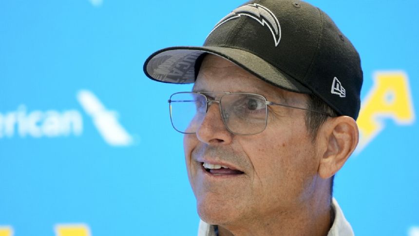 NCAA hands former Michigan coach Jim Harbaugh a 4-year show cause order for recruiting violations