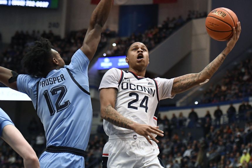 Newton has triple-double, No. 21 UConn tops No. 10 Marquette