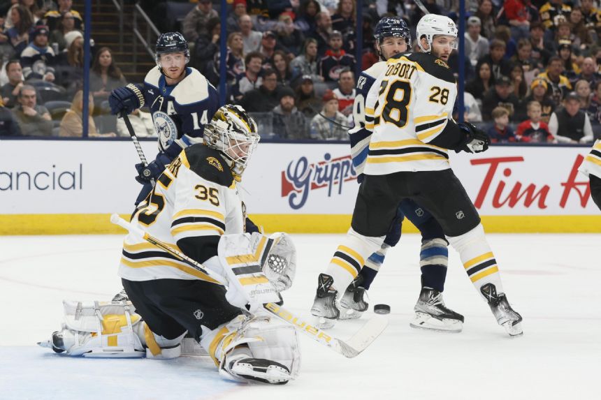 NHL-leading Bruins beat Blue Jackets 4-0 for 5th win a row