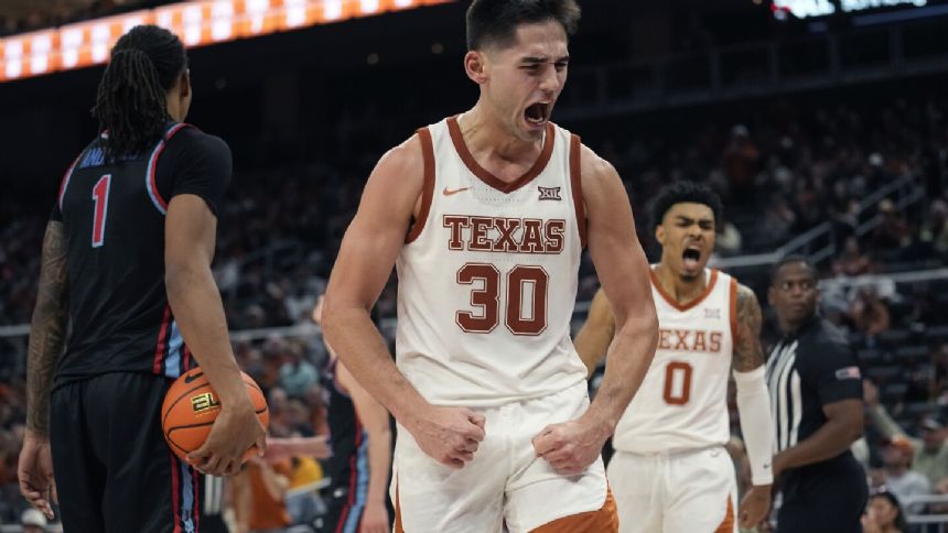 No. 18 Texas uses 3-pointers to pull away and beat Delaware State 86-59