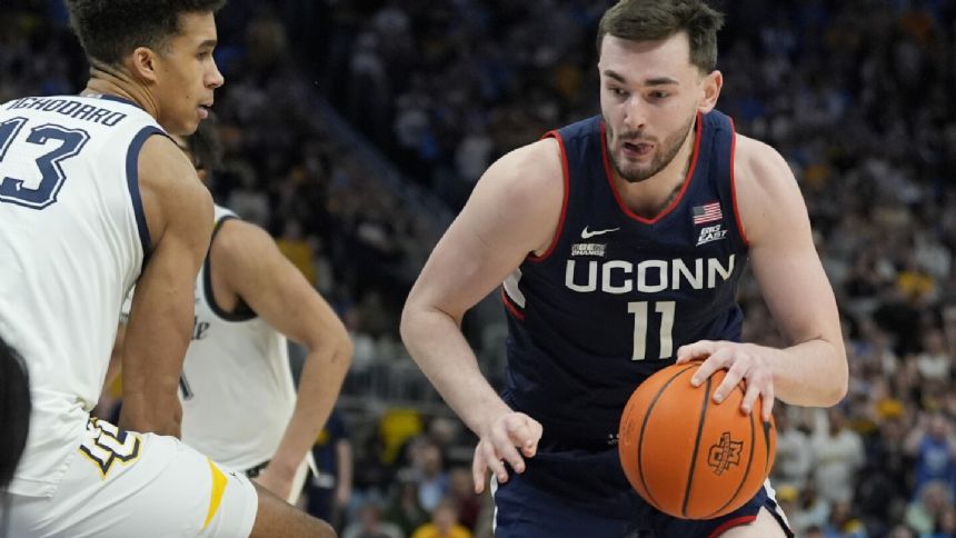 No. 2 UConn outlasts No. 8 Marquette 74-67 for 1st Top 25 road win in a decade