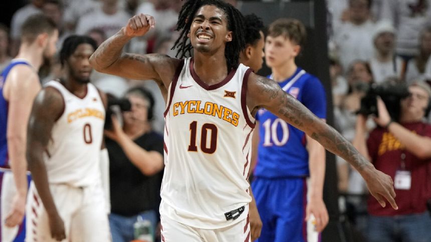 No. 23 Iowa State beats No. 7 Kansas 79-75, runs home winning streak to 13 games