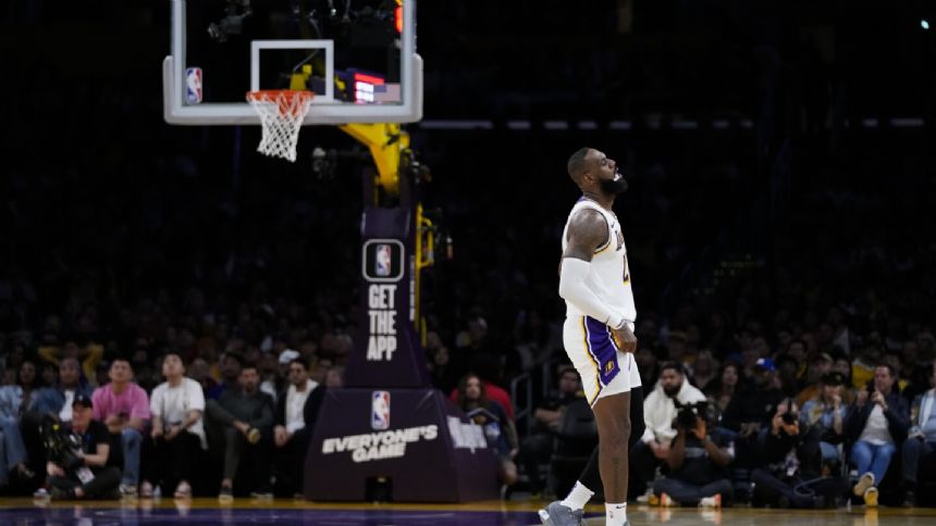 Nullified 3-pointer by James, shot clock malfunction make for lengthy ending to Warriors-Lakers