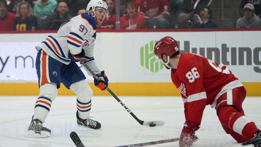 Nurse scores in OT and Oilers top Red Wings 3-2 to tie franchise record with 9th straight win