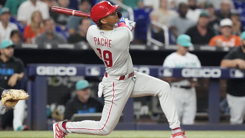 Pache's pinch-hit, 2-run HR rallies Phils past Marlins for record-tying 13th straight road win
