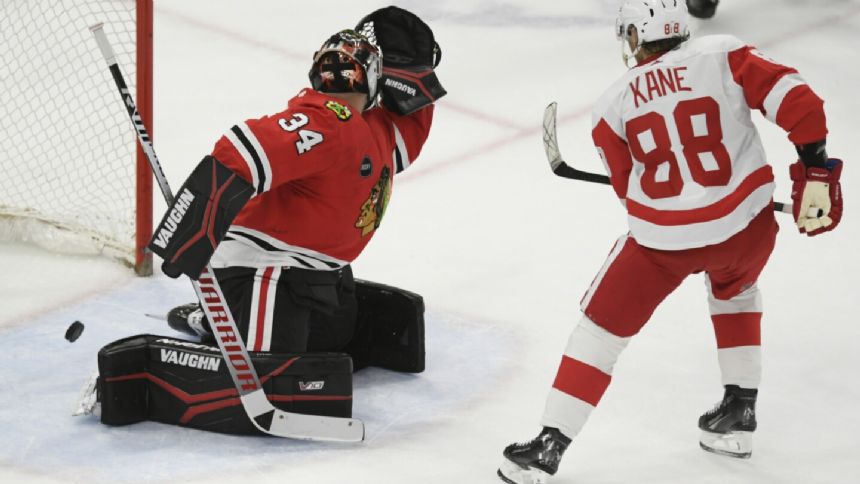 Patrick Kane scores in overtime in Chicago return, sending Red Wings past the Blackhawks 3-2