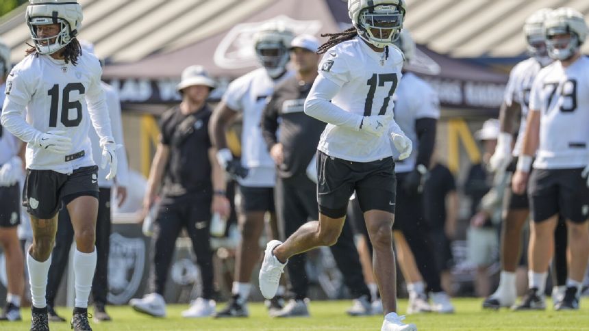 Raiders star wide receiver Davante Adams isn't going anywhere -- for now, at least