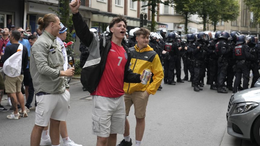 Riot police in Germany intervene to stem fan clashes ahead of England vs. Serbia soccer match