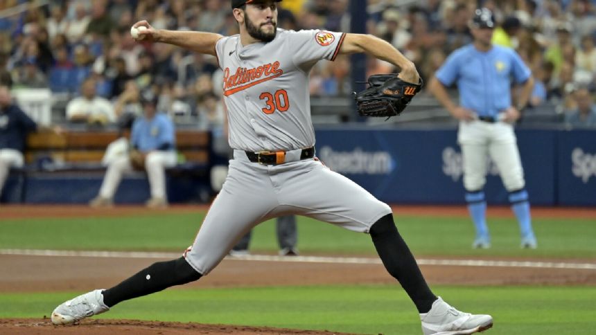 Rodriguez takes perfect game into the 6th, Rutschman has slam and drives in 6, Orioles beat Rays 9-2