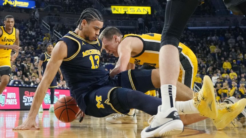 Sandfort scores 26, Perkins 24 and Iowa topples Michigan 88-78