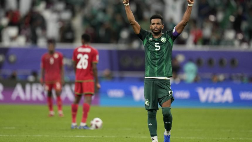 Saudi Arabia beats Oman 2-1 with stoppage-time winner in the Asian Cup