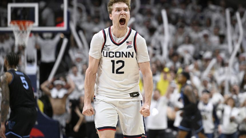 Spencer scores 25 points, Newton has a triple-double and top-ranked UConn beats Villanova 78-54