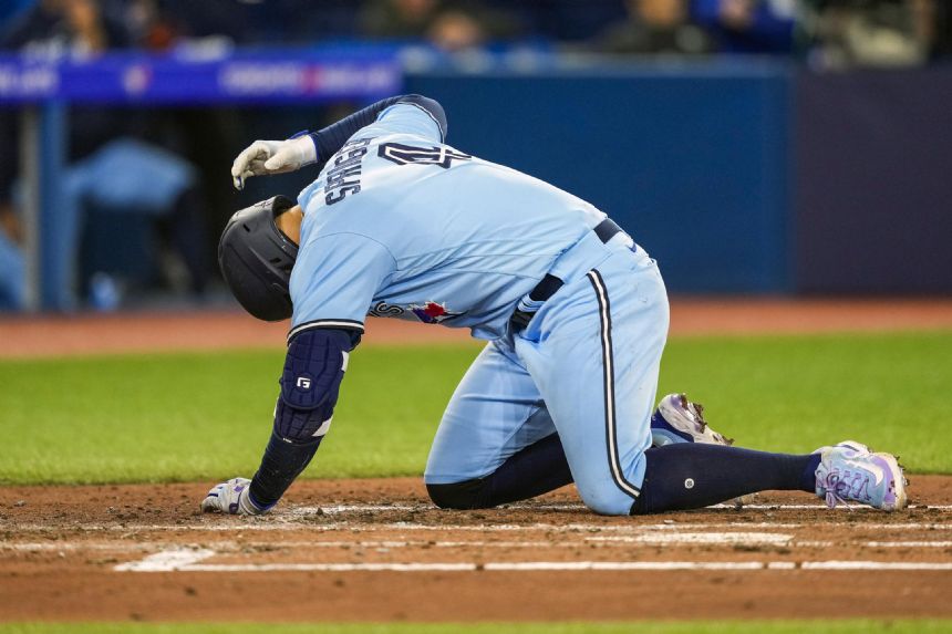 Springer leaves game after being hit on right hand by pitch