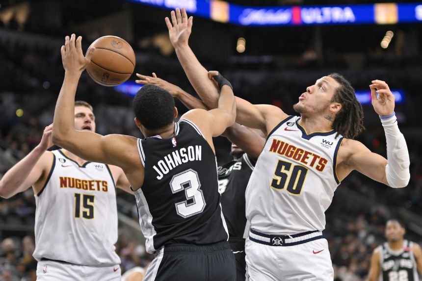 Spurs overcome Jokic's triple-double to top Nuggets 128-120