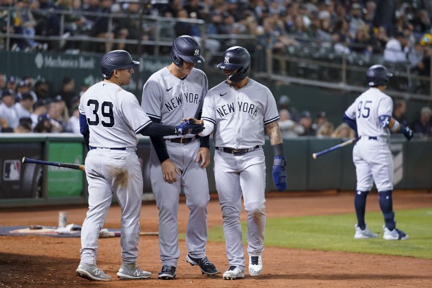 Stanton returns from injury, Yankees pound Athletics 13-4