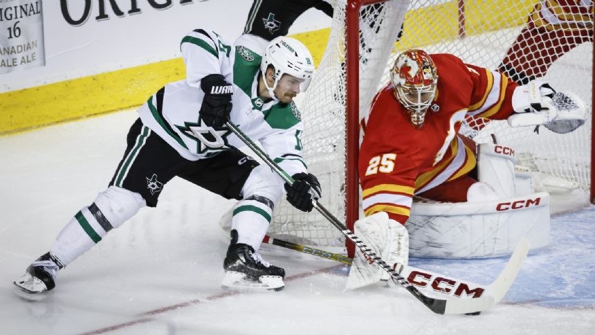 Stars score 3 in 2nd period and hold on to beat Flames 4-3