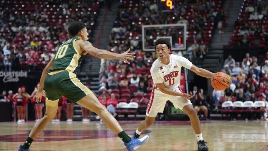 Thomas scores 23 points to lead UNLV to 66-60 win over No. 22 Colorado State