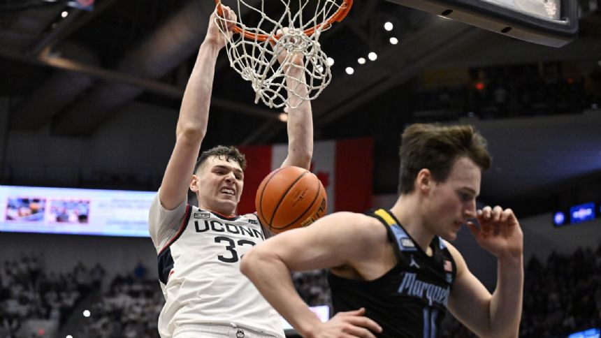 Top-ranked UConn uses a balanced attack, routs No. 4 Marquette to take control of the Big East