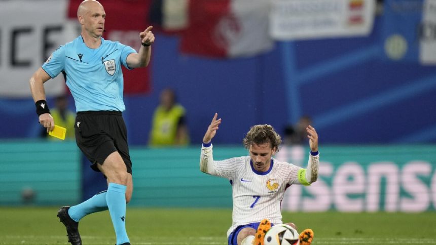 Tougher action on tactical fouls by Euro 2024 referees drives spike in yellow cards shown