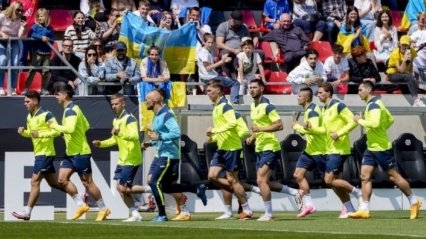 Ukraine arrives at Euro 2024 to a patriotic welcome and vivid reminder of the war at home