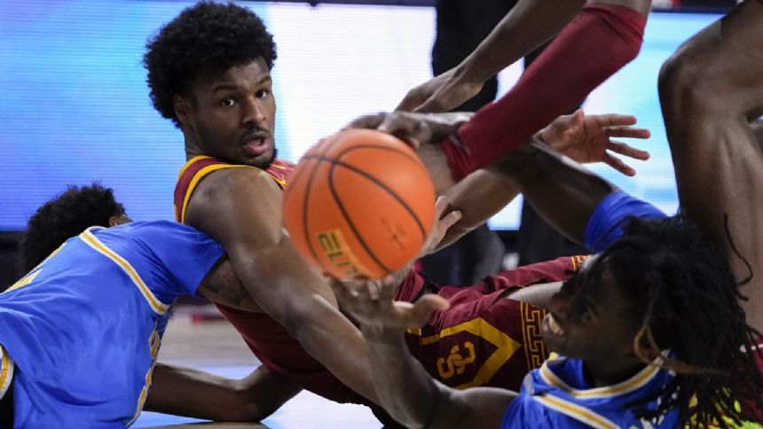 USC's Bronny James picks up technical foul after a blocked shot against UCLA