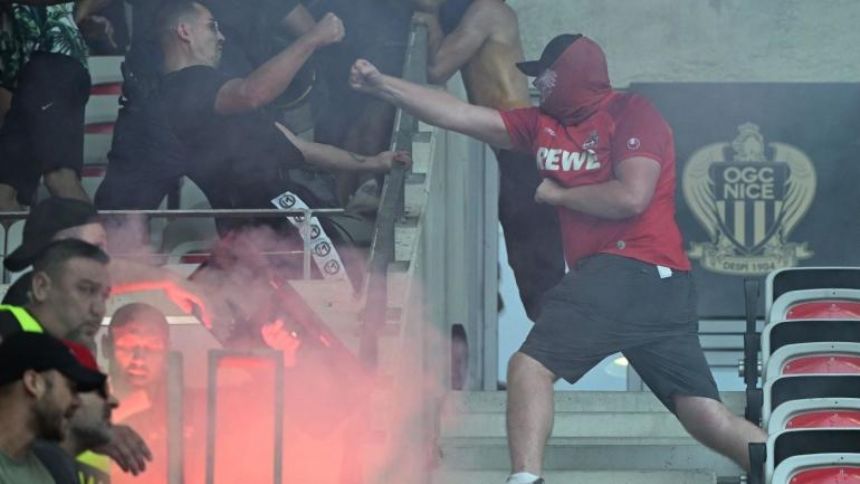 Violence delays Nice-Koln Europa League match; injuries reported as flairs, fighting litter Allianz Riviera