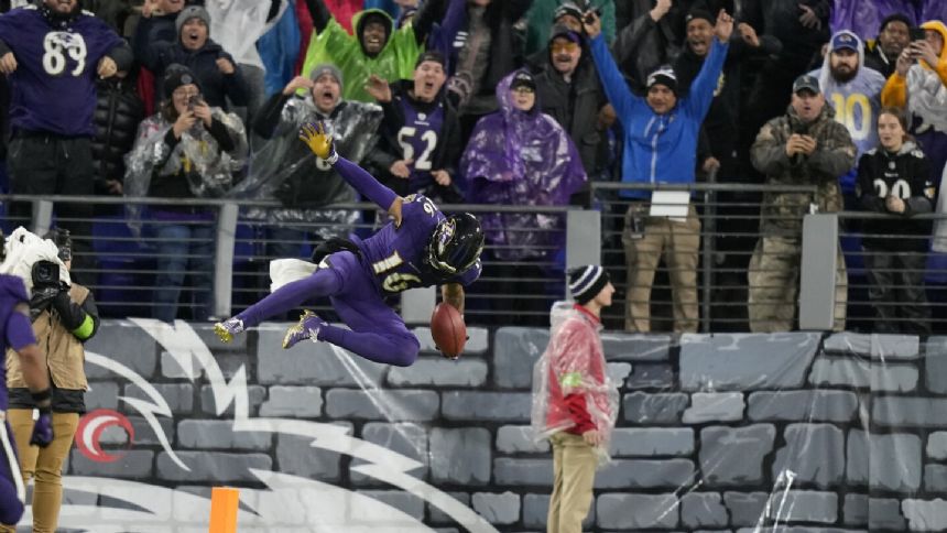 Walk-off Wallace: Ravens punt returner goes 76 yards for TD in OT in a 37-31 win over the Rams