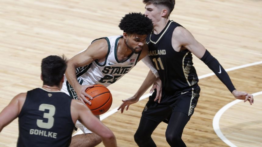 Walker tops 1,000 career points, Michigan State cruses past Oakland 79-62