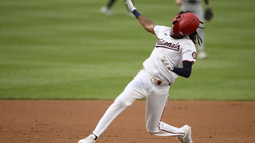 Wood homers, triples and scores four runs, and the Nationals beat the Giants 11-5