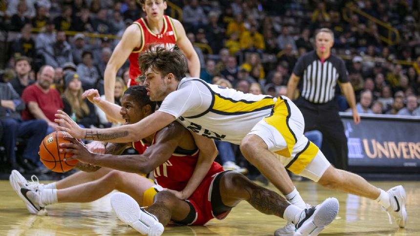 Young scores 22 points, hits game winner with 1.5 seconds left to get Maryland past Iowa 69-67