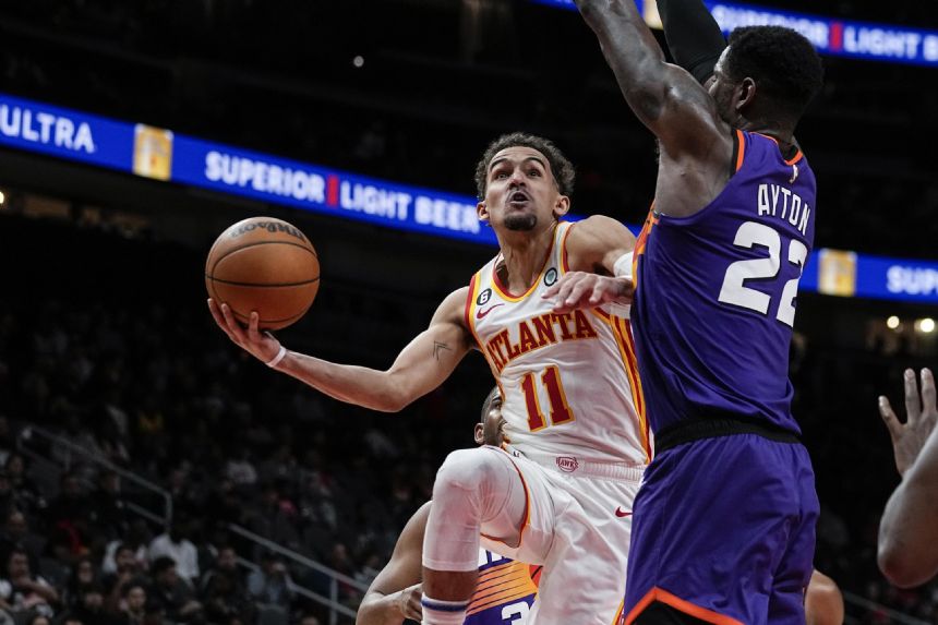 Young scores 36 as Hawks beat short-handed Suns 116-107