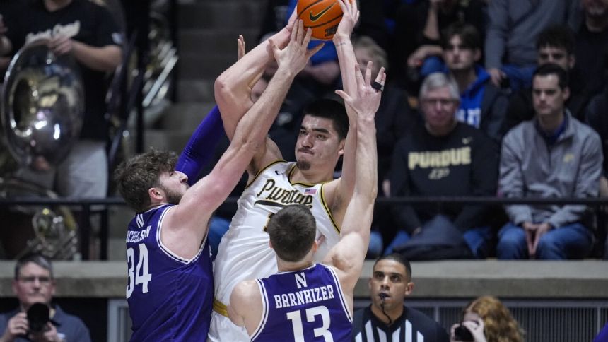 Zach Edey scores 10 of his 30 points in overtime to send No. 2 Purdue past Northwestern 105-96